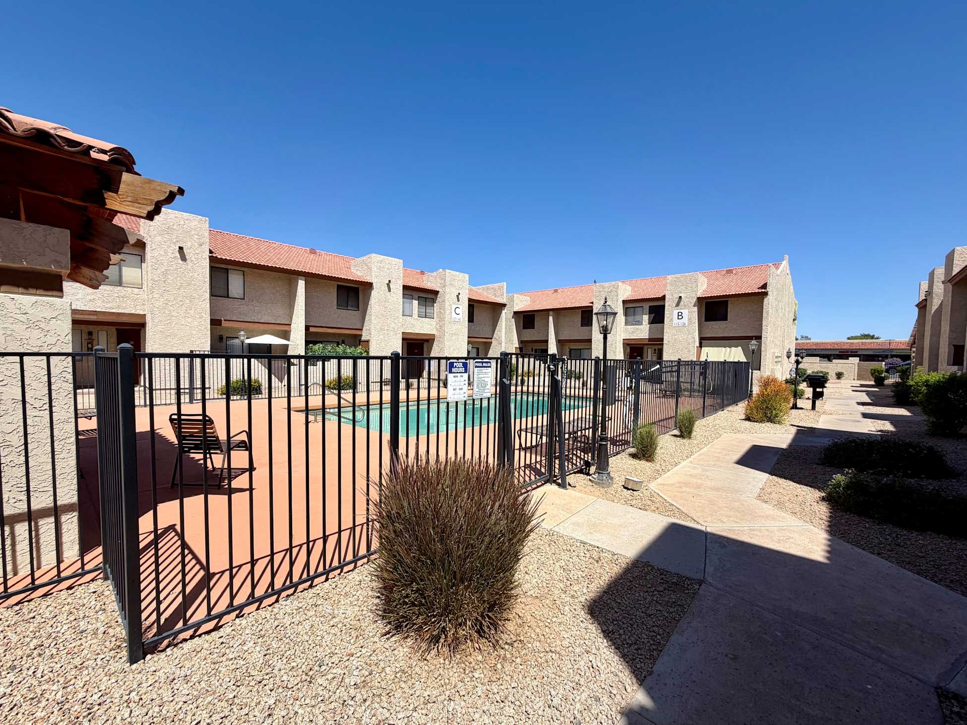 Pool and poolside area at Windsprings Apartments.