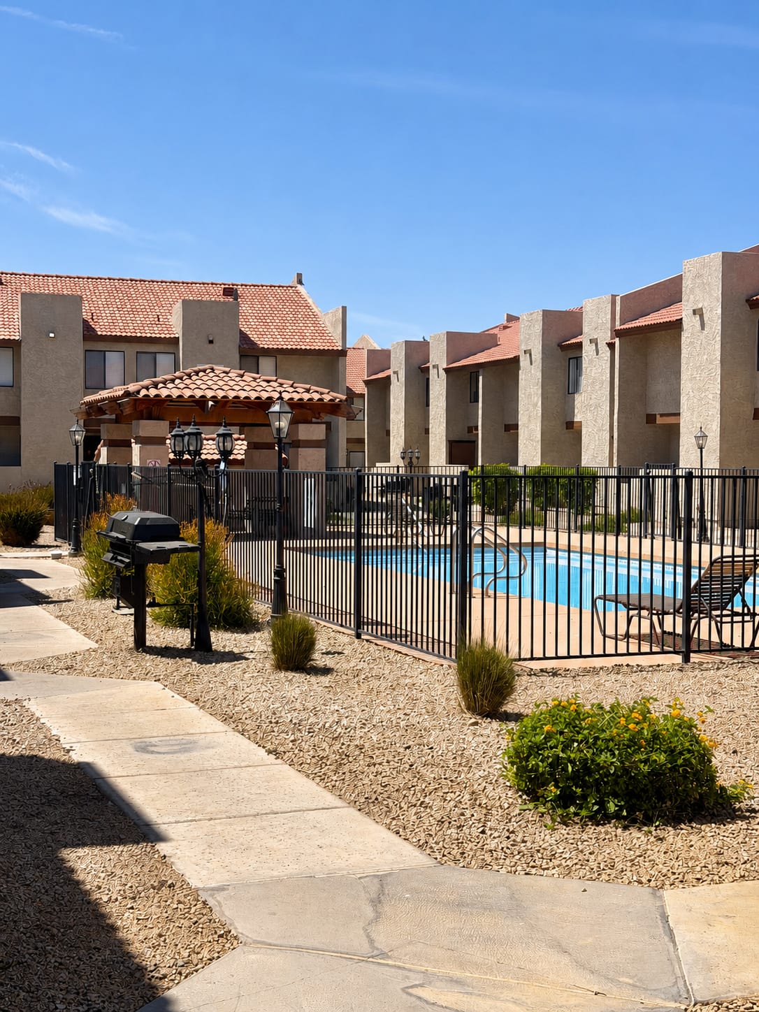 Pool and poolside area at Windsprings Apartments.
