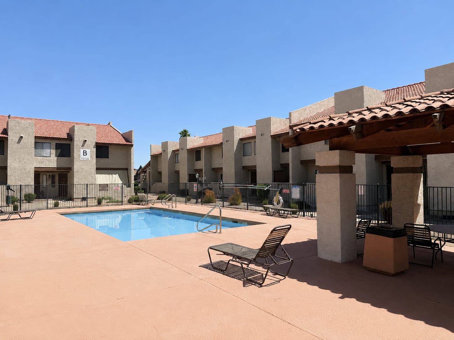 Pool and poolside area at Windsprings Apartments.