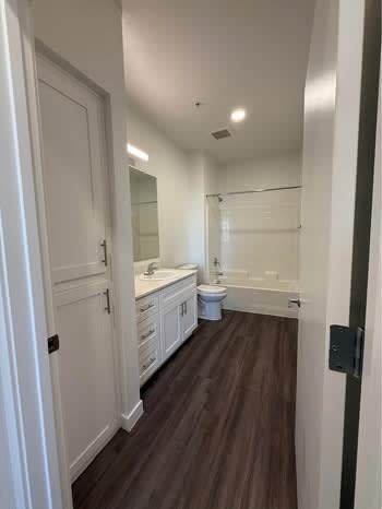 Apartment bathroom — representative home at Mustang Villas.