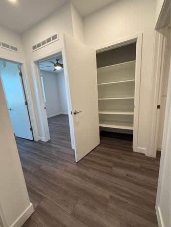 Walk-in closet — representative home at Mustang Villas.