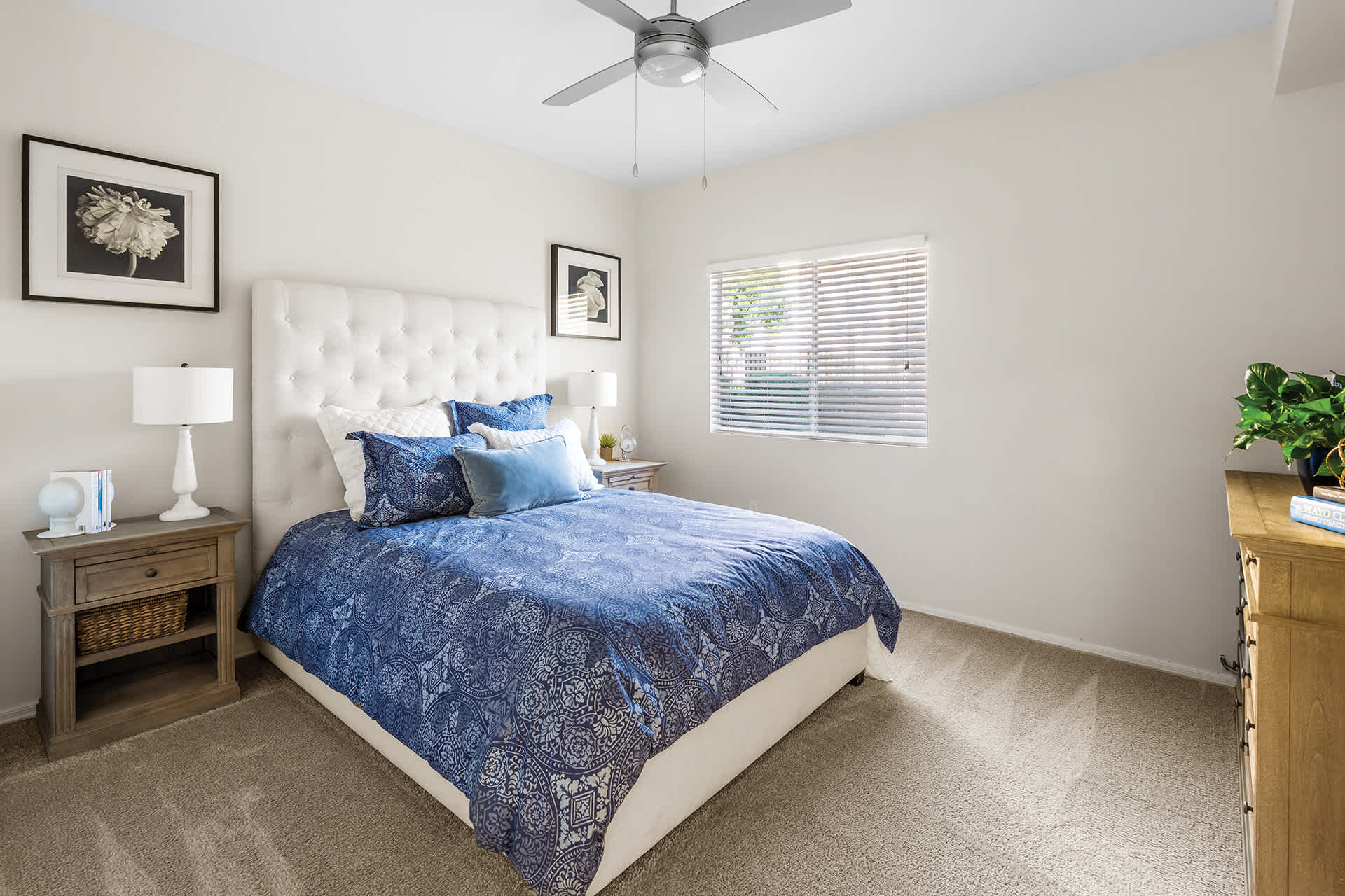 Furnished bedroom shown — representative home at Sonterra Apartments at Paradise Valley.