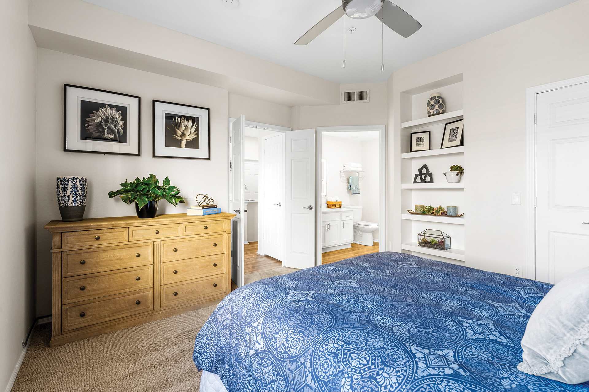 Furnished bedroom shown — representative home at Sonterra Apartments at Paradise Valley.