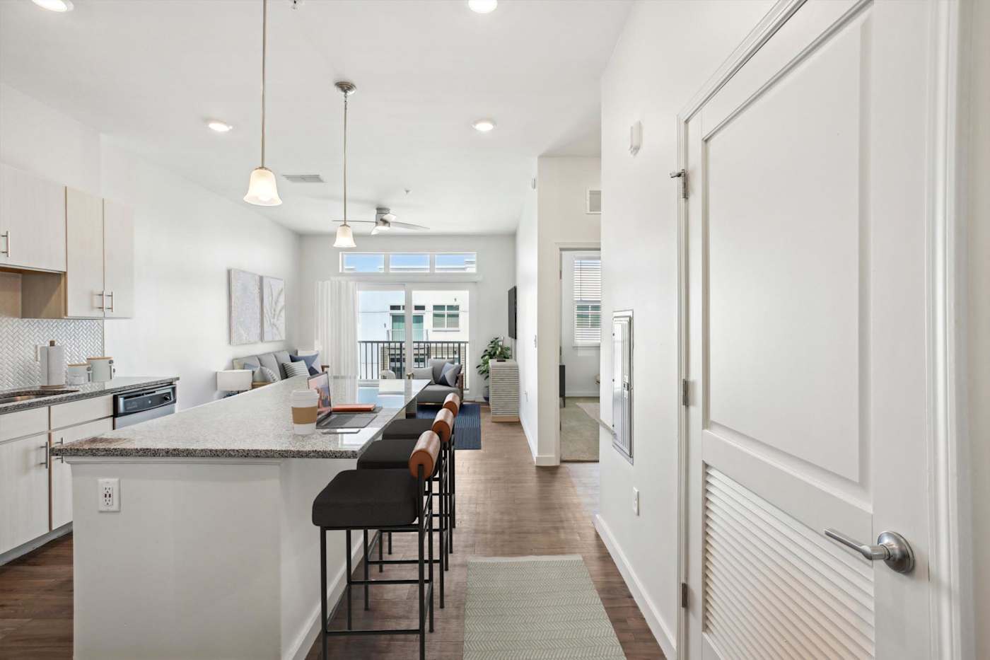 Modern kitchen and living area inside a home at 10X Tarpon Springs