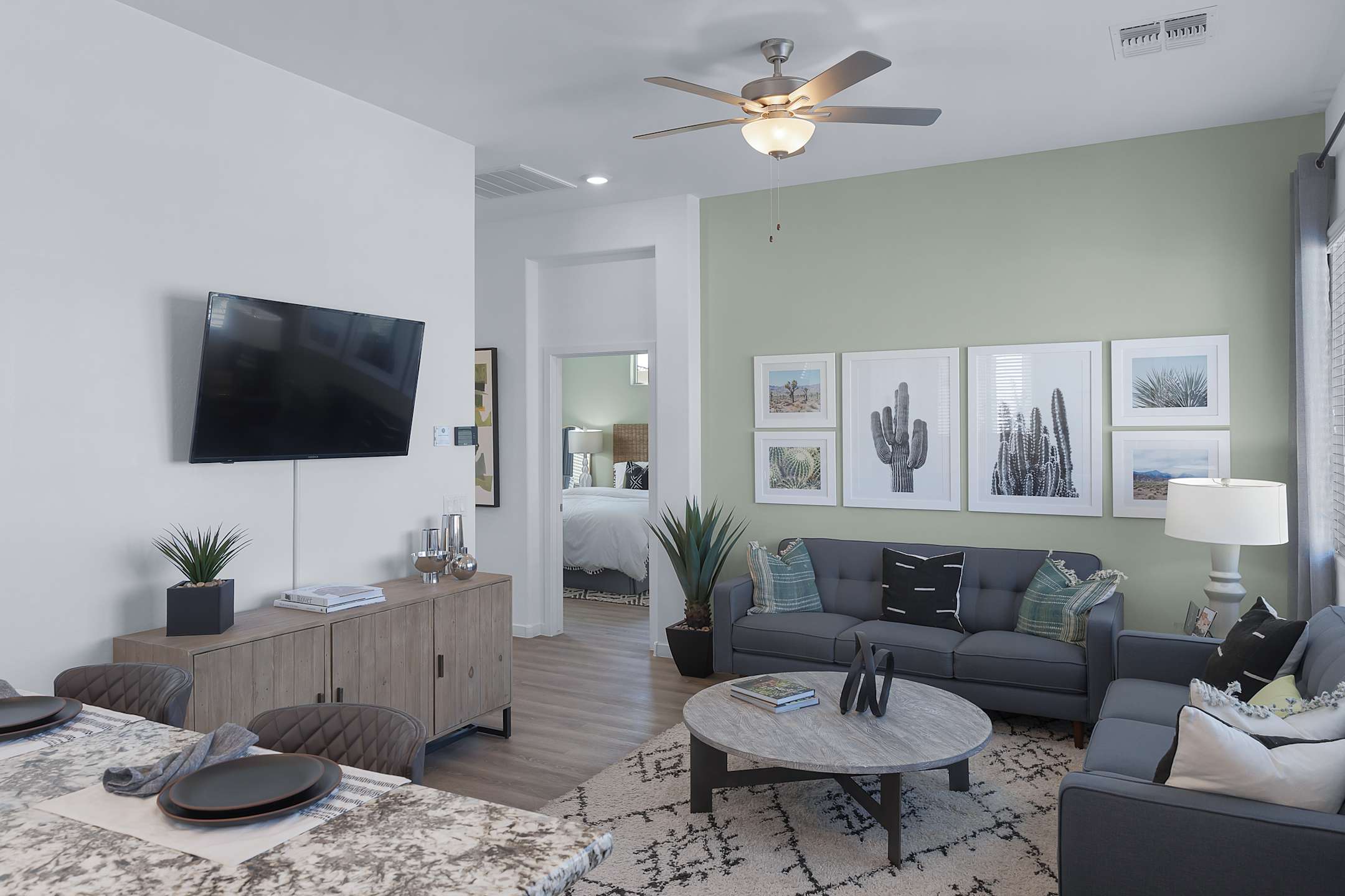 Furnished apartment living area shown — representative home at Avilla Magnolia.