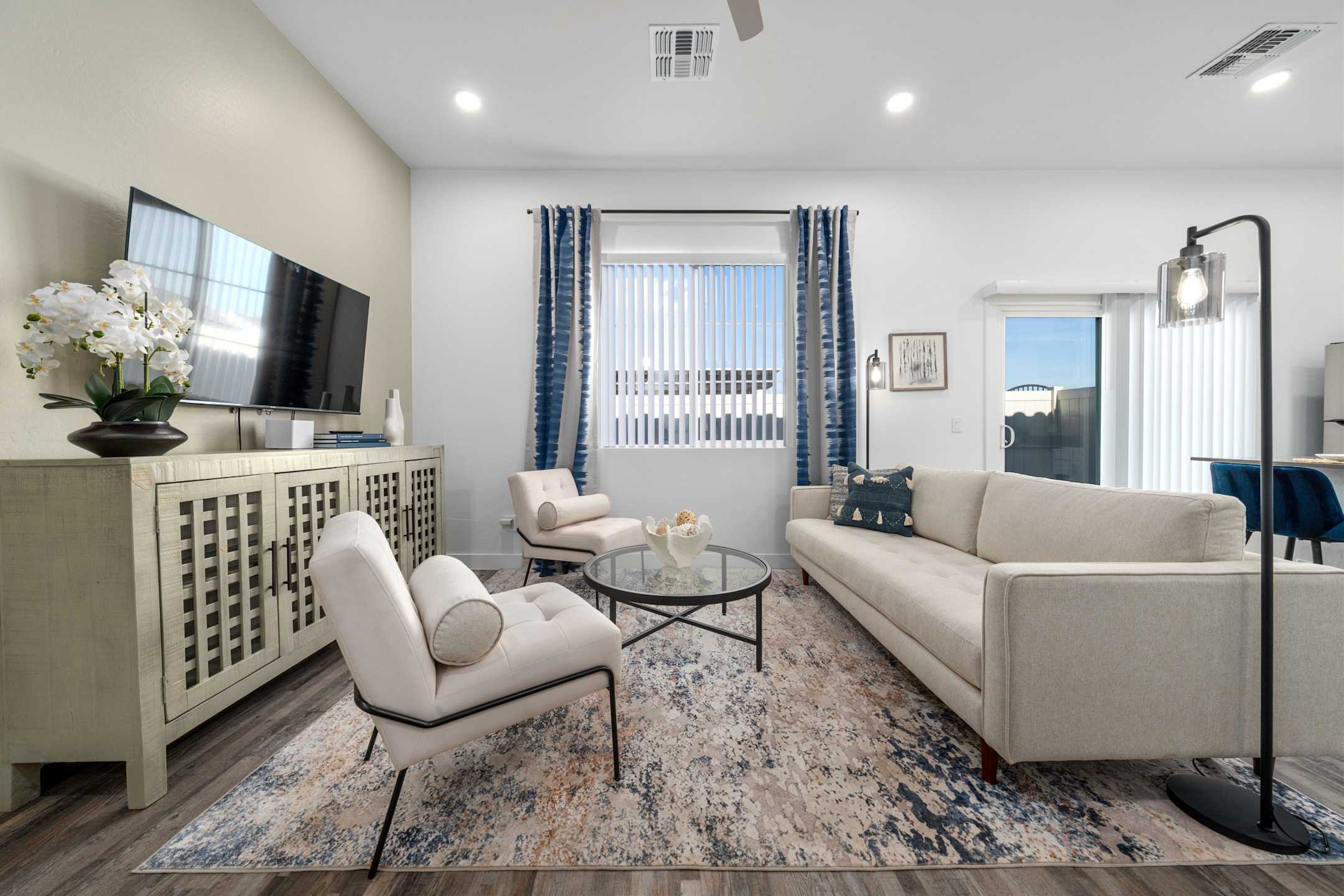 Furnished apartment living area shown — representative home at Allero 59.