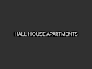 a dark room with the words hall house apartments