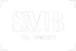 a green and white sign with the word smb hollywood