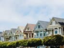 a row of colorful houses sitting next to each other