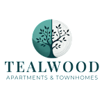 A logo for Tealwood Apartments & Townhomes featuring a tree.