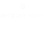 A black and white image of a logo for Hickory Point Townhomes.
