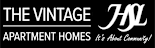 A black and white logo for The Vintage Apartment Homes.