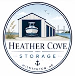 A logo for Heather Cove Storage in Wilmington, NC features a boat in a garage.
