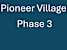 A blue background with white text reading Pioneer Village Phase 3.