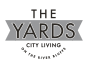 a logo for the yards city living on the river bluffs