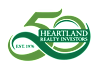 The image is a logo for Heartland Realty Investors, established in 1976.