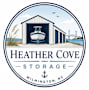 A logo for Heather Cove Storage in Wilmington, NC features a boat in a garage.