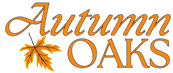 a neon sign that reads autumn oaks with a maple leaf
