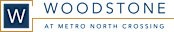 A logo with a large W and the words "Woodstone at Metro North Crossing" in front of it.