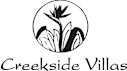 A logo with a plant and the words "Creekside Villas".