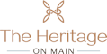 A logo with a leaf design and the words "The Heritage" and "on main" in a serif font.