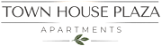 A sign that says "Town House Plaza Apartments" with a leaf symbol.