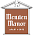 a small sign for mend mend manor apartments