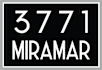 A black and white sign with the numbers 3771 and the word Miramar.