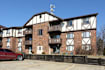 The image is a logo for Elijah Apartments.