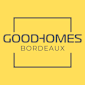 A yellow sign with the words "Good-Homes Bordeaux" written in black.