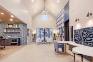 A residential lounge area with tables and chairs at The Wheeler townhomes near Salt Lake City, UT.