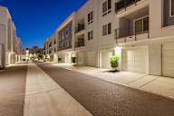 an empty street in an apartment building at night
