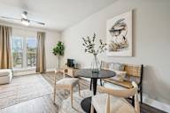 our apartments offer a living room and dining room with a table and chairs