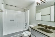 a bathroom with a shower and a sink and a mirror at Connect on Missouri, Phoenix, AZ