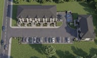 An aerial view of a townhouse site, featuring both townhouse blocks.