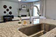 a kitchen with granite counter tops and a sink at Herrin Farms, Georgia, 30011