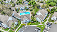 A bird's eye view of the garden apartment community, showing the Leasing Clubhouse, pool, and various apartment buildings.