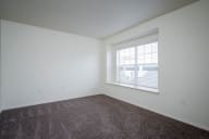 Village at Main Street | 2x2 Bedroom Two with Wall to Wall Carpeting and Light Filled Window