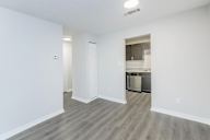 Kitchen area with a dishwasher and a refrigerator.
