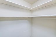 An empty white room with a white ceiling.