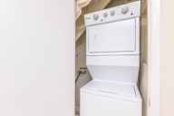 White dishwasher and oven in a small kitchen.