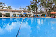 Swimming pool with a rope in the middle of it.