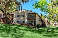 Building with a green lawn in front of it.