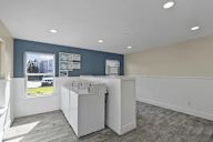 A kitchen area with a window and a sink.