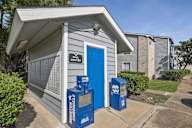 A Houston Chronicle newspaper box sits outside a mail center.