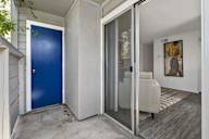 A blue door is on the left and a glass door is on the right.