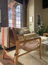 a living room with a couch and a chair