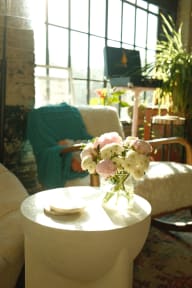 a vase of flowers on a table in a living room