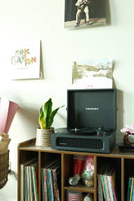 a tv on a bookshelf in a living room