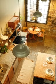 an overhead view of a kitchen with a table and chairs